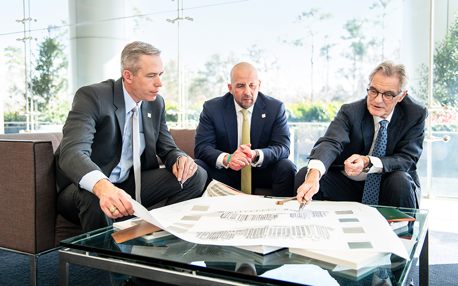 Action shot of team members looking through paperwork